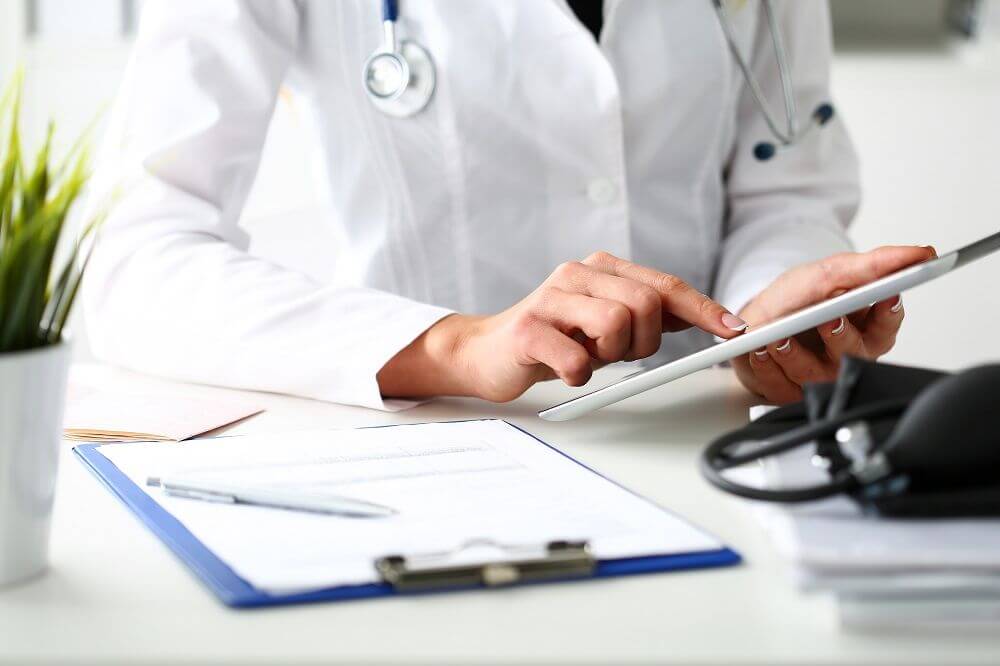 Doctor holding ipad
