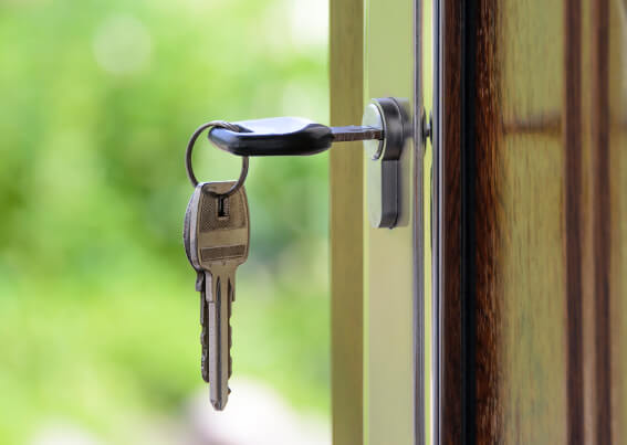 Wooden door with key in the lock