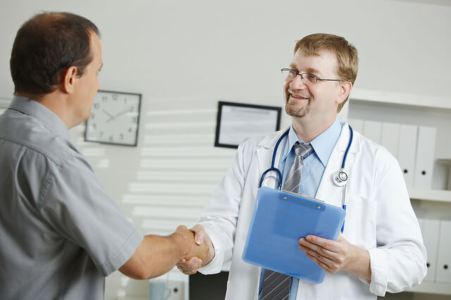 Doctor and patient shaking hands