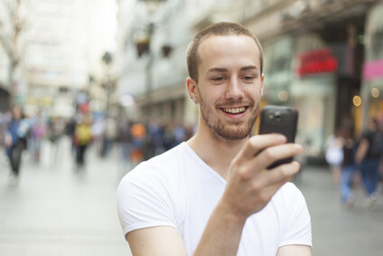 Man with phone in city