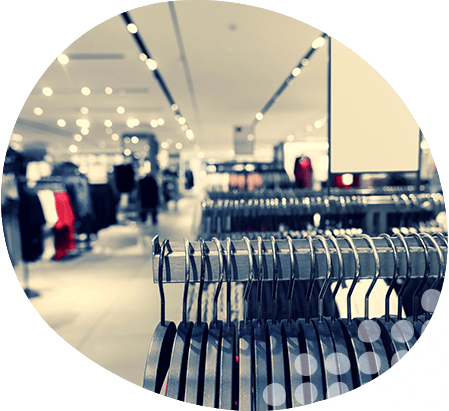 Bright department store with multiple clothes rails