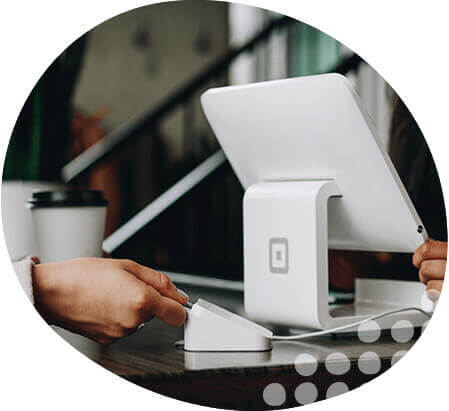 Photo of person paying for coffee in coffee shop