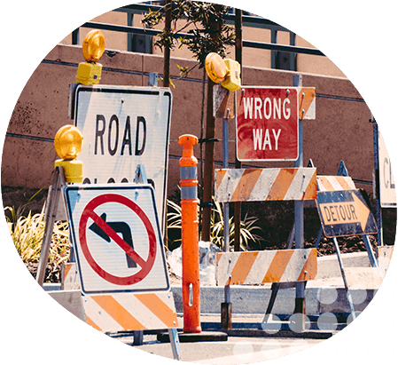 Multiple road closed signs with diversion arrows